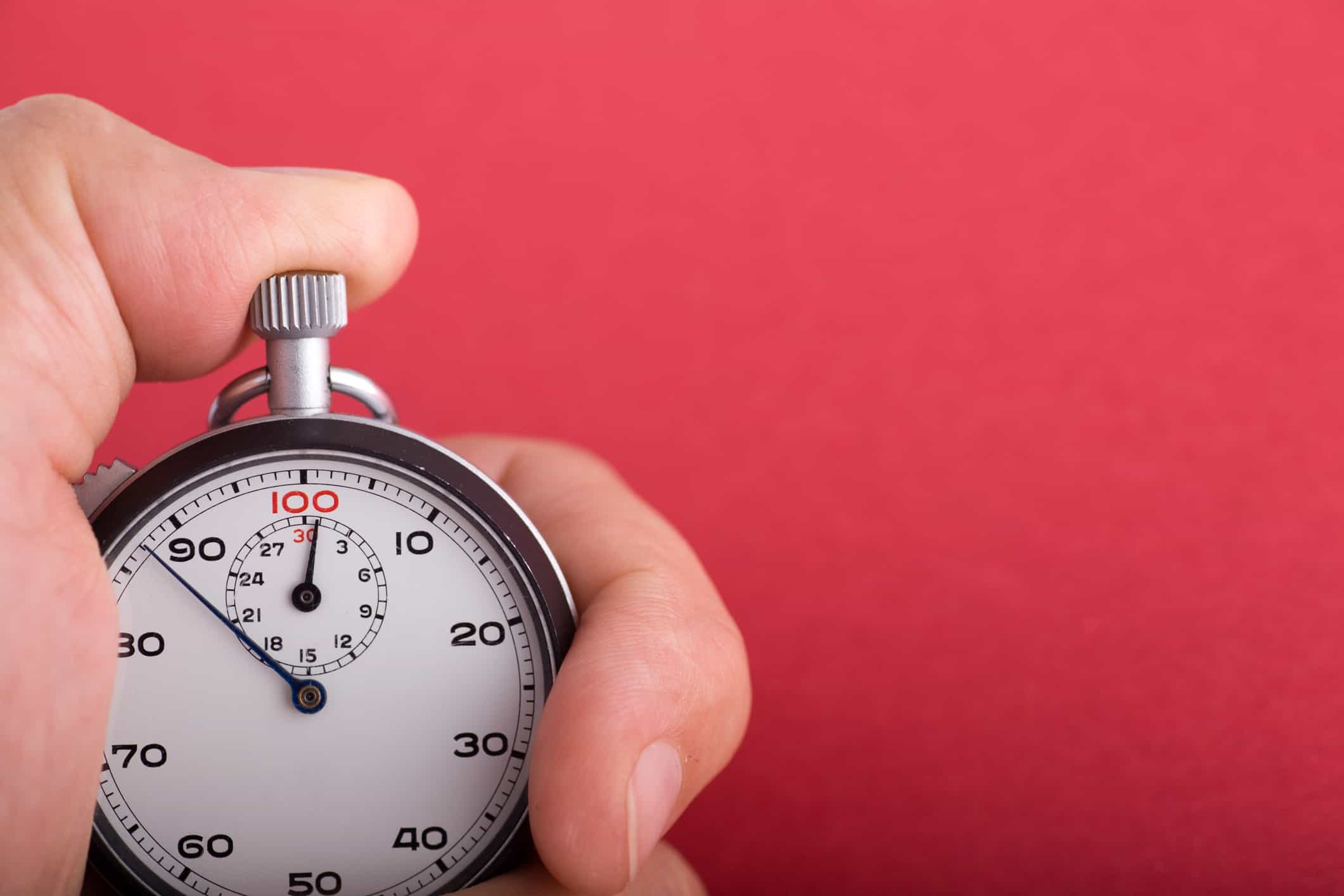 "Vintage, analog stopwatch in hand."